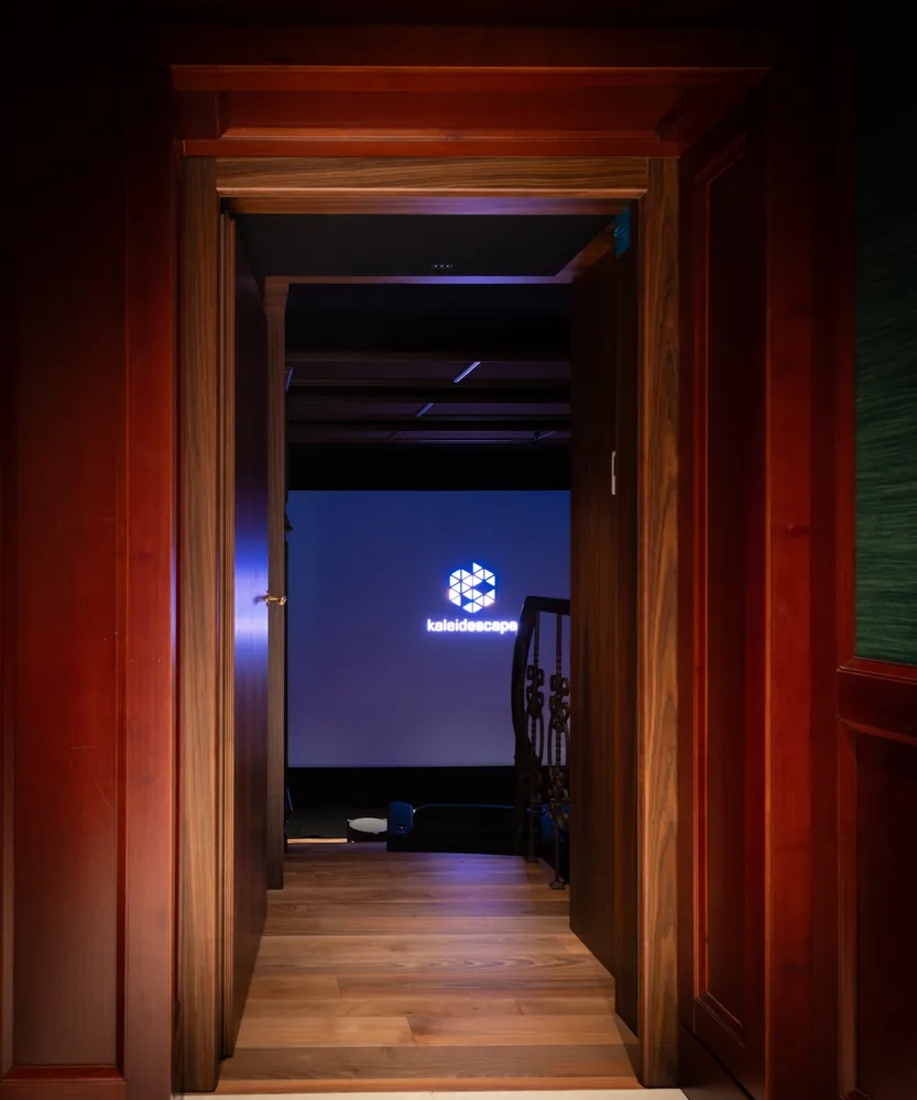 The entrance lobby with a timber-lined corridor leading to the cinema door